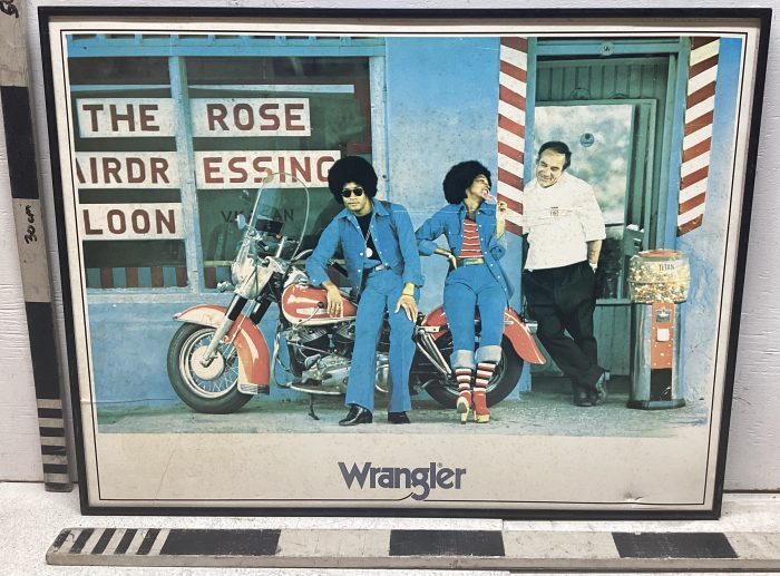 Portrait photo of two bikers and a barber
