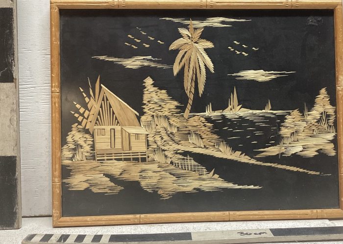 Wooden collage of villa on beach