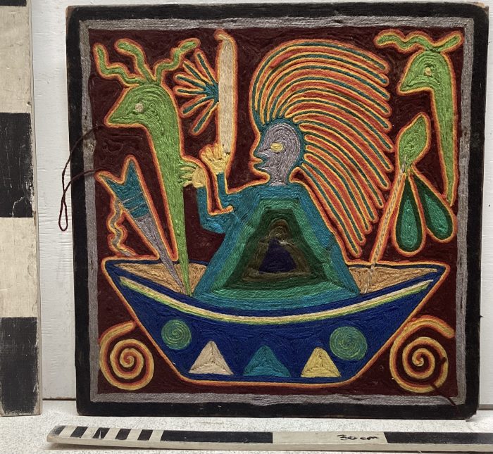 Fabric artwork of a person in a boat